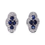 A PAIR OF SAPPHIRE CLUSTER AND DIAMOND EARRINGS