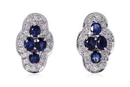 A PAIR OF SAPPHIRE CLUSTER AND DIAMOND EARRINGS