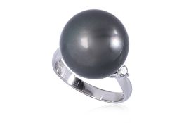 A CULTURED TAHITIAN PEARL AND DIAMOND RING