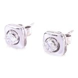 A PAIR OF DIAMOND STUD EARRINGS