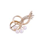 AN AKOYA CULTURED PEARL AND GOLD BROOCH BY MIKIMOTO