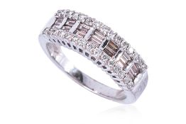 A BAGUETTE AND ROUND DIAMOND RING