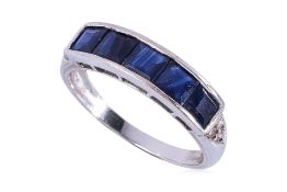 A CHANNEL SET SAPPHIRE AND DIAMOND RING