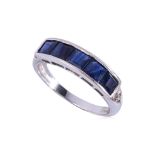 A CHANNEL SET SAPPHIRE AND DIAMOND RING