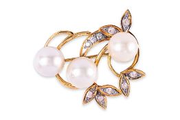 A CULTURED SOUTH SEA PEARL AND WHITE SAPPHIRE BROOCH