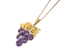 A SYNTHETIC PURPLE STONE 'GRAPE' PENDANT WITH CHAIN