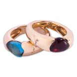 A PAIR OF TOPAZ AND GARNET RINGS BY POMELLATO