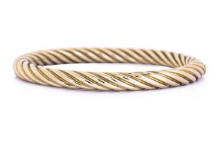 A GOLD BANGLE BY TIFFANY & CO.