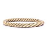 A GOLD BANGLE BY TIFFANY & CO.