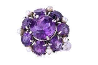 AN AMETHYST AND SEED PEARL FLOWERHEAD RING