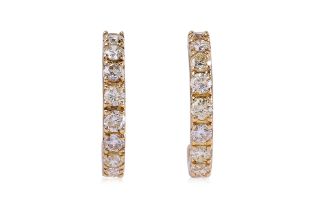 A PAIR OF HALF HOOP DIAMOND EARRINGS