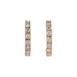 A PAIR OF HALF HOOP DIAMOND EARRINGS