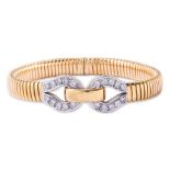 A DIAMOND AND TWO TONE GOLD BRACELET