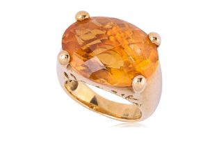 A LARGE CITRINE AND GOLD RING