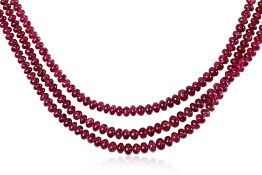 A THREE STRAND RED SPINEL BEADS NECKLACE