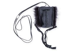 A GUCCI LEATHER EMBOSSED HANDBAG WITH FUR DETAILING