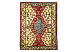 A KAZAK RUG IN BLUE, RED AND CREAM WOOL (205 x 130cm)