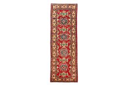 AN AFGHAN KAZAK WOOL HALL RUNNER (305 x 84cm)