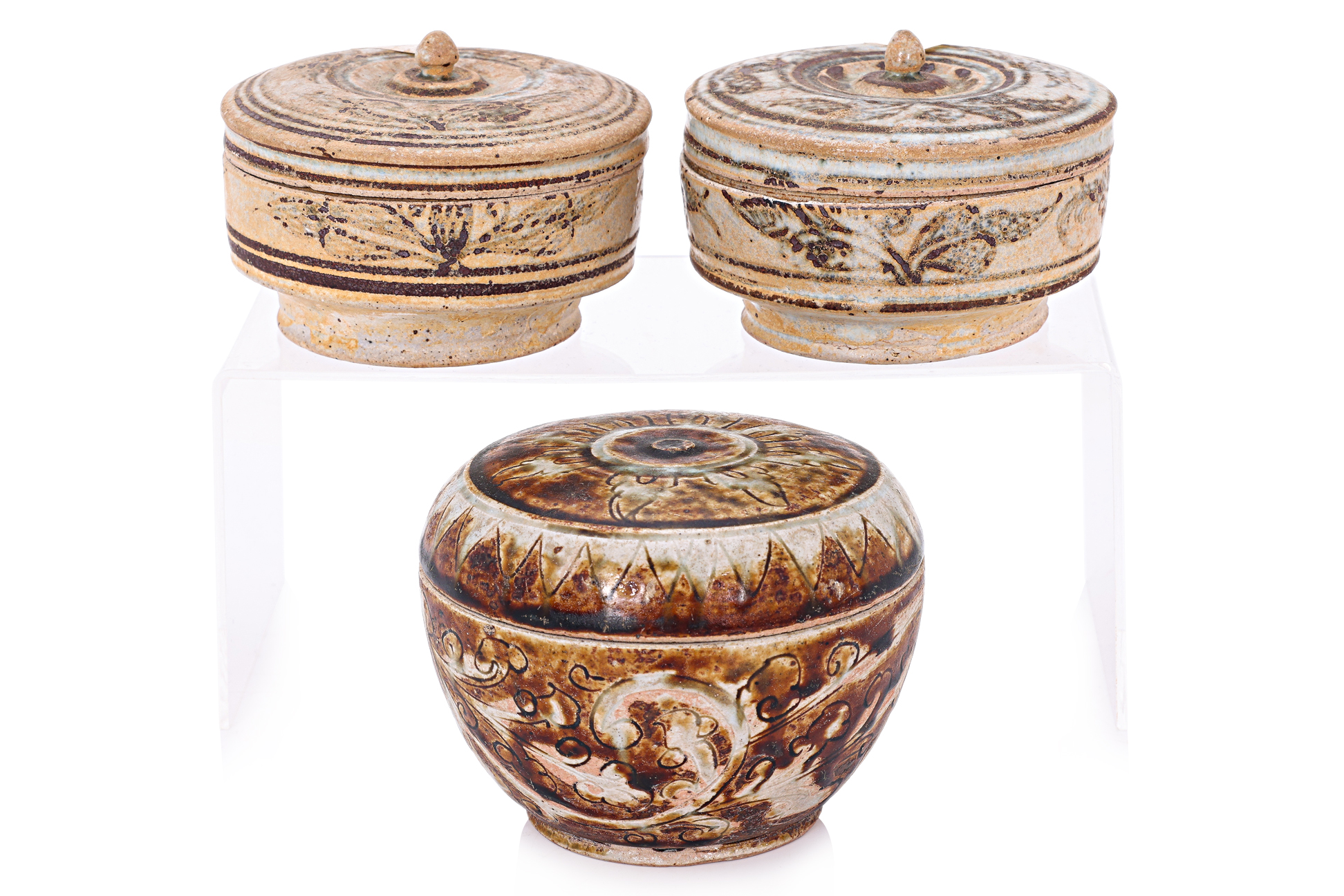 A GROUP OF THREE THAI COVERED JARS