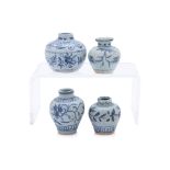 A GROUP OF FOUR SMALL BLUE AND WHITE JARS