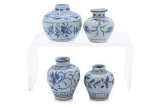 A GROUP OF FOUR SMALL BLUE AND WHITE JARS