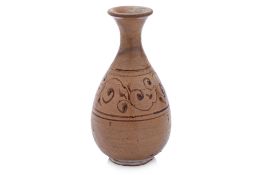 A PEAR SHAPED CLEAR GLAZED BOTTLE VASE