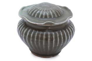 A LONGQUAN CELADON RIBBED JAR WITH LOTUS LEAF COVER