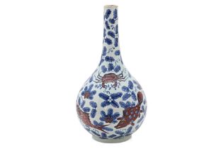 AN UNDERGLAZE BLUE AND RED PORCELAIN BOTTLE VASE