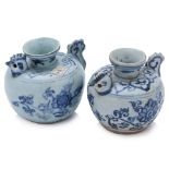 A PAIR OF BLUE AND WHITE PORCELAIN CHICKEN WATER DROPPERS