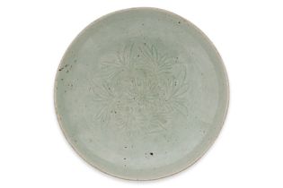 A LONGQUAN CELADON CARVED PEONY DISH