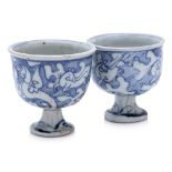 TWO SIMILAR BLUE AND WHITE PORCELAIN STEM CUPS