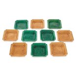 A GROUP OF TEN SMALL GREEN AND YELLOW GLAZED DRAGON DISHES