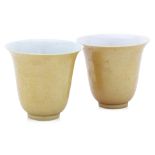 A PAIR OF YELLOW-GLAZED TEA CUPS