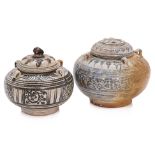 A GROUP OF TWO THAI JARS AND TWO COVERS