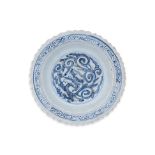 A BLUE AND WHITE DRAGON DECORATED DISH