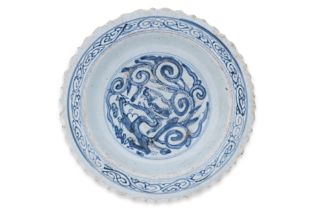 A BLUE AND WHITE DRAGON DECORATED DISH