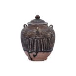 A THAI BROWN-GLAZED JAR AND COVER