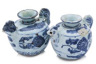 A PAIR OF BLUE AND WHITE PORCELAIN CHICKEN WATER DROPPERS