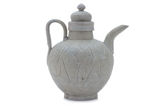 A CARVED GREEN-GLAZED CELADON EWER AND COVER