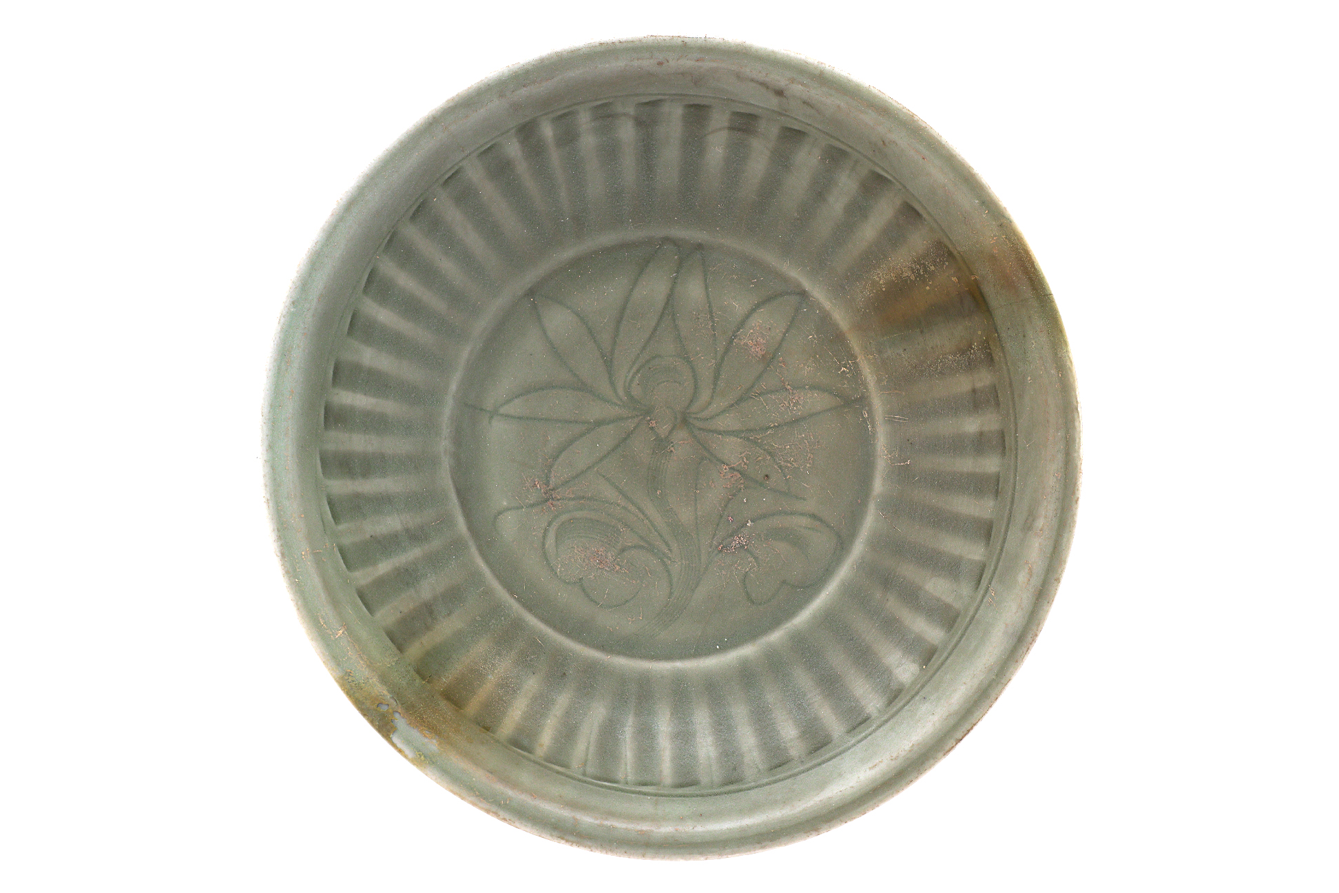 AN INCISED AND FLUTED CELADON DISH