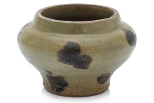 A SMALL IRON-SPOT CELADON JAR