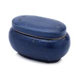 A MONOCHROME BLUE-GLAZED OVAL BOX, COVER AND LINER