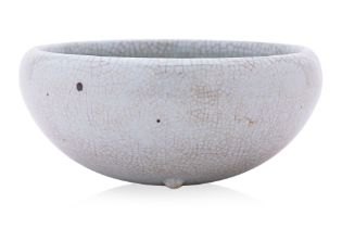 A CRACKLE GLAZED PORCELAIN ALMS BOWL