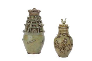 TWO JIN STYLE CELADON FUNERARY URNS AND COVERS