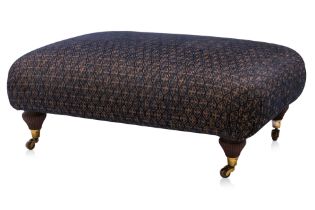 AN UPHOLSTERED OTTOMAN