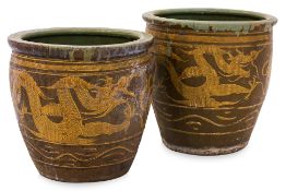 A PAIR OF BROWN GLAZED DRAGON POTS