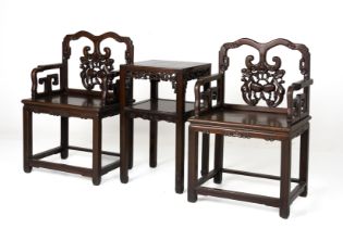 A PAIR OF BLACKWOOD ARMCHAIRS AND TABLE