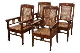 A SET OF FOUR COLONIAL TEAK ARMCHAIRS