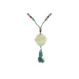 A CHINESE CARVED JADE PENDANT