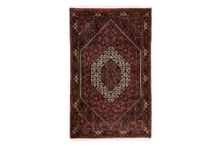 A BIJAR WOOL RUG (187 X 111 CM)